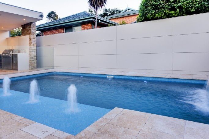 Compass Pools Sydney Fibreglass pool with 2 water features front Compass Pools Sydney Fibreglass pool with 2 water features front